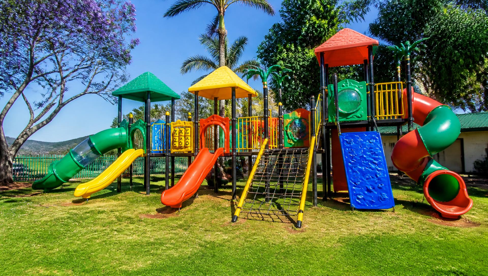 Colourful jungle gym with slides and climbing frames in a sunny South African park